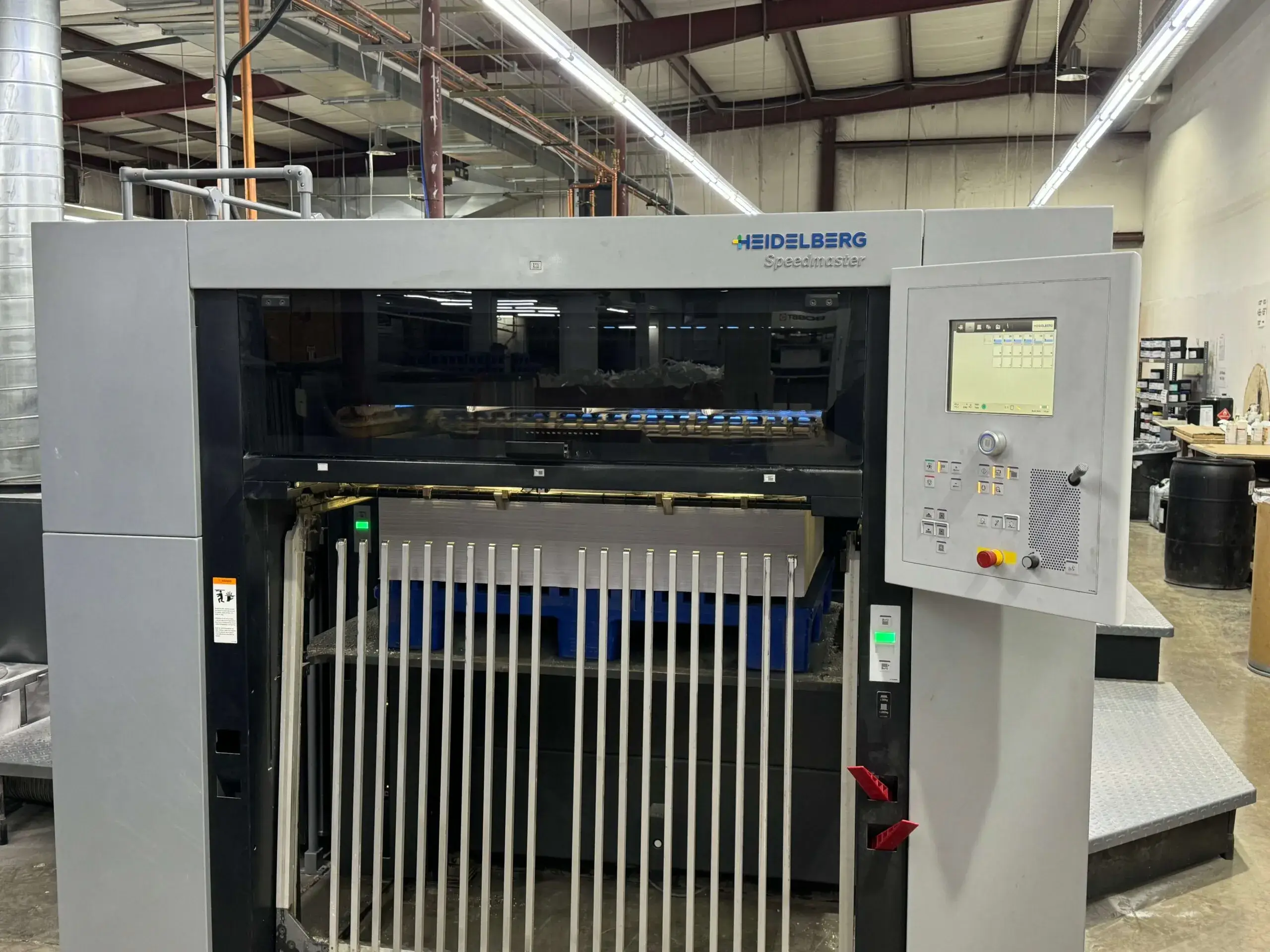 Front End of Offset press, printing folding cartons with UV lights to dry UV coating.